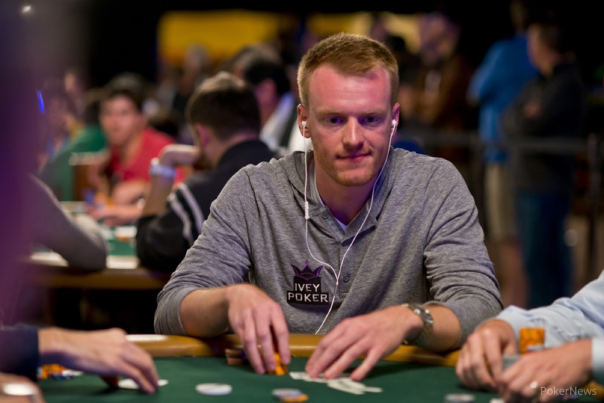 Cole South at a WSOP table in an Ivey Poker hoodie